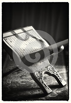 Islamic prayer beads placed on a Holy Quran