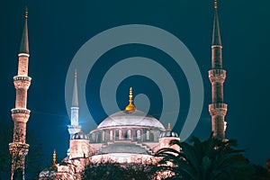 Islamic or Ramadan concept photo. Dome and minaretes of Blue Mosque at night photo
