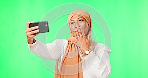 Islamic woman, selfie and green screen with kiss, studio background or happy in social media mock up. Female muslim