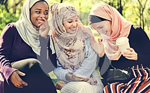 Islamic women friends talking and having fun photo