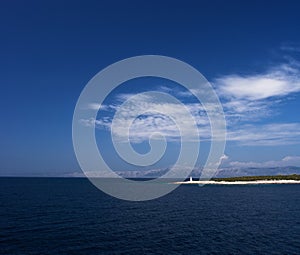 Island in Adriatic sea with beacon