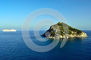 The island of Bergeggi and the cruise ship Costa C