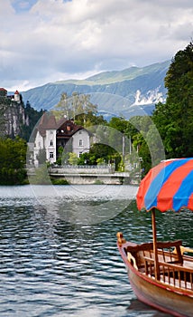 The island of Bled, Bled castle on cliff, Julian Alps and Church of the Assumption,Bled, Slovenia.