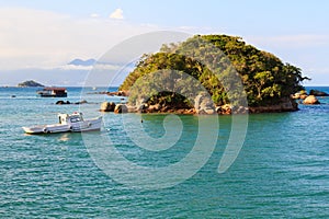 Island boat sea mountains Abraao Beach of Ilha Grande, Brazil