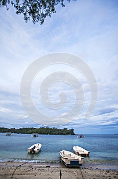 The island, the boats, the cloud and the blue sky, beautiful view of Iboih Beach, in Sabang, Indonesia