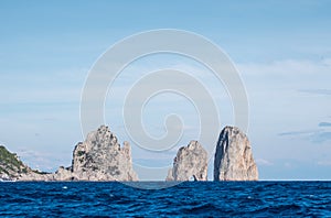 Island of Capri, Italy. Faraglioni, famous sea stacks, off the coast.