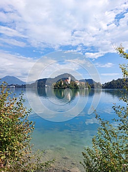 island with church at sunny day. Slovenia. Lake Bled