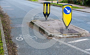 Island and dedicated cycle route at traffic calming choke point