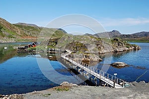 Island with fishing village in fjord, Mageroya.