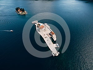 Island of Gospa od Skrpjela against the background of the island of St. George. Top view