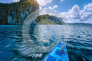 Island hopping Tour boat on speed passing exotic karst limestone islands on travel tour trip exploring Bacuit