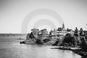 Island with house, cottage or villa on Islands of Sweden in black and white