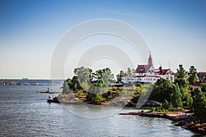 Island with house, cottage or villa on Islands of Sweden in sunny summer day