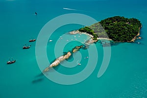 Island Ilha do Frances with boats and blue ocean in Florianopolis. Aerial drone view photo