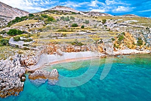 Island of Krk idyllic pebble beach with karst landscape, stone deserts of Stara Baska photo