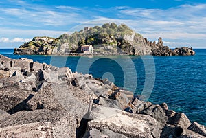 The island Lachea in the coastline in the Riviera dei Ciclopi, near Catania