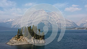 Island in a Lake infront of a Mountain.