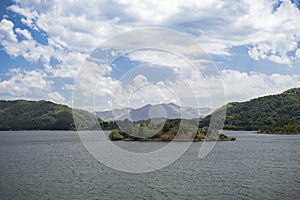 An Island of a Lake under Clouds.