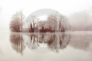 The island of memory drowned in the fog, in the heart of the lake TÃÂªte d`or  in Lyon France photo