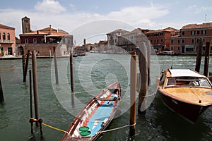 Island Murano in Venice Italy. View on canal with boat and motorboat water. Sunny Summer day. Travel. Vacation ideas