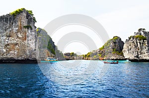 Island, ocean and mountains background for tropical, adventure and holiday with boats, journey and travel. Outdoor