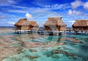 Island in ocean, overwater villas