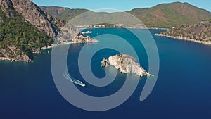 Island in the ocean and rocks summer rest panorama background of mountains in sea bay blue Marmaris, Icmeler Turkey