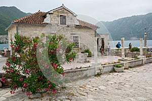 The island of Our Lady Gospa od Skrpjela on the reef is located near Perast