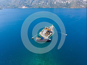 Island of Our Lady of The Rocks in kotor bay in montenegro. aerial view. summer time