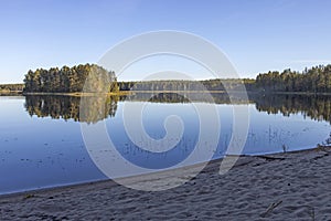 An island overgrown with trees on Lake Onega