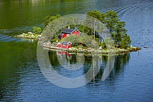 Island with Red House in Lovrafjord in Rogaland