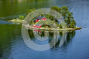 Island with Red House in Lovrafjord in Rogaland photo