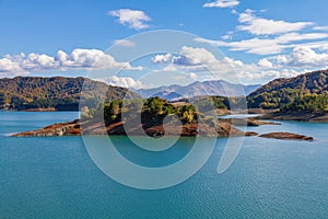 Island on the scenic Aoos artificial lake in Epirus, Greece