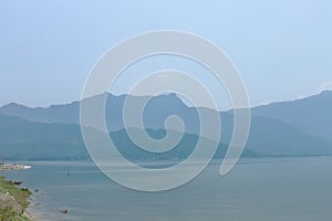 Island, sky and calm sea photo