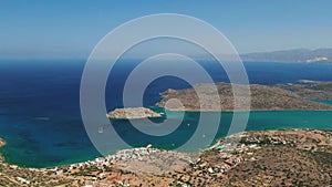 Island of Spinalonga with old fortress former leper colony and the bay of Elounda, Crete island, Greece