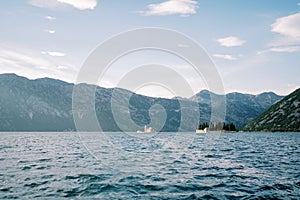 Island of St. George in the Bay of Kotor with the island of Gospa od Skrpjela in the background. Montenegro