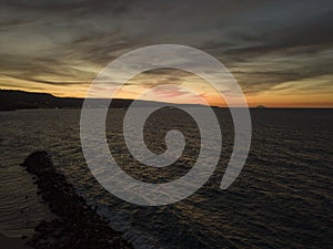 Island of Stromboli. Volcano seen at sunset from the Calabrian coast. Italy