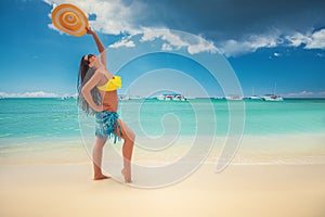 Island in the tropics. Happy walking girl enjoying tropical sandy beach, Saona island, Dominican Republic