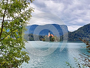 island with white church on lake Bled. Slovenia. Cloudy