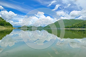 The Islands and mountains on reservior in dam. On the day of clouds and cloud reflection in the beautiful water of  KaengKrachan