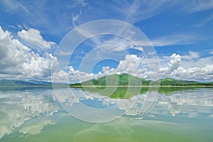 The Islands and mountains on reservior in dam. On the day of clouds and cloud reflection in the beautiful water o