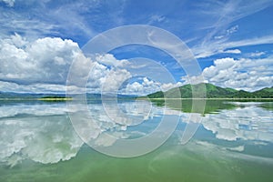 The Islands and mountains on reservior in dam. On the day of clouds and cloud reflection in the beautiful water o