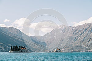 Islands of St. George and Gospa od Skrpjela in the Bay of Kotor with the mountains in the background. Montenegro photo