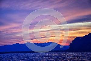 Islands Sunset, Ocean panorama views near Phuket with deep Red, Orange, Purple and Blue, mountains, twilight in Thailand. Includin