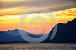 Islands Sunset, Ocean panorama views near Phuket with deep Red, Orange, Purple and Blue, mountains, twilight in Thailand. Includin