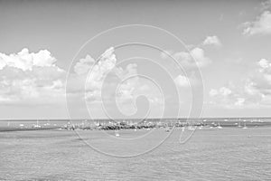 Isle land and sailboats in turquoise sea in key west, usa. Seascape with sailing boats on cloudy blue sky. Sailing and