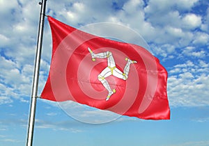 Isle of Mann flag waving with sky on background realistic 3d illustration