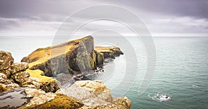 Isle of Skye landscape - Neist Point lighthouse, rocky cliffs, Atlantic Ocean