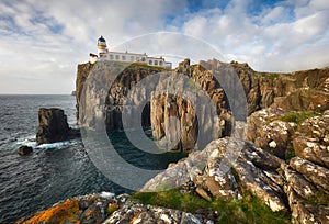 Isle of Skye lighthouse at Neist Point with beautiful golden light, beautiful landscape with sea - Scotland