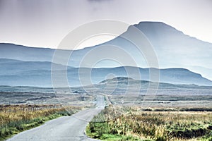 Isle of Skye - misty island landscape - hills silhouette covered in mist